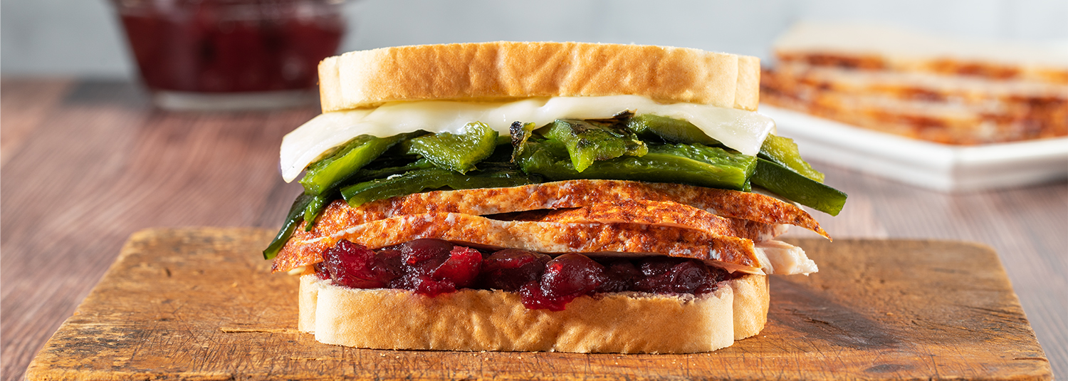 Turkey sandwich with poblano peppers, cranberry sauce and white cheddar